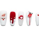 Medium coffin Christmas press-on nails with Santa faces, snowflakes, winter hats, and sparkling rhinestone accents in festive red and white