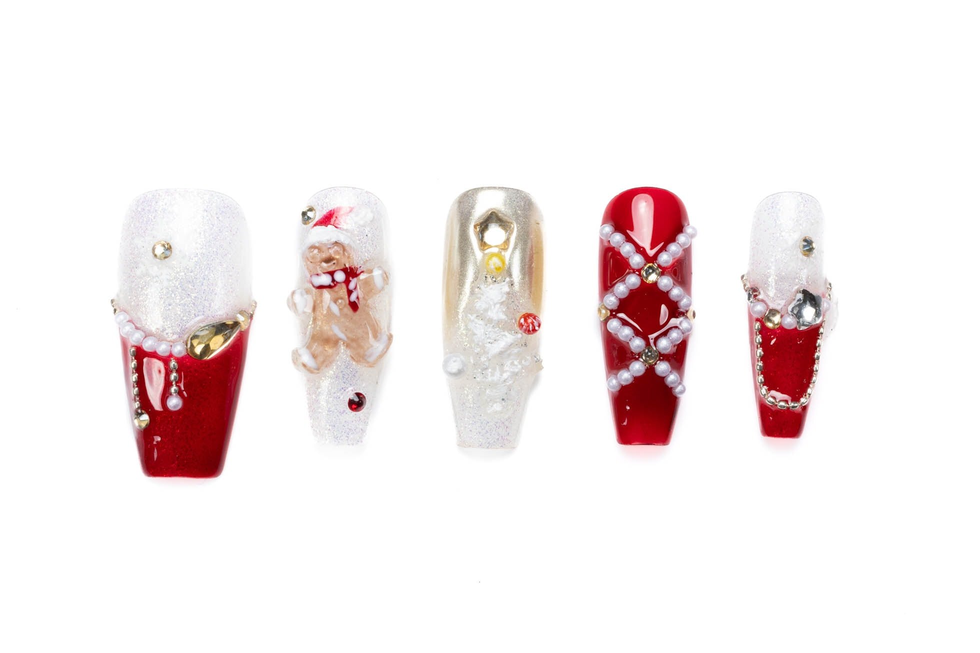 Festive medium coffin press-on nails with Christmas designs including gingerbread men, trees, glitter, and pearl embellishments