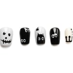 Short squoval Halloween press-on nails featuring black and white spooky designs with ghost faces, googly eyes, and black cats