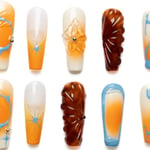 Long coffin press-on nails showcasing orange, white, and blue swirl patterns with brown accents and 3D decorative elements on white background