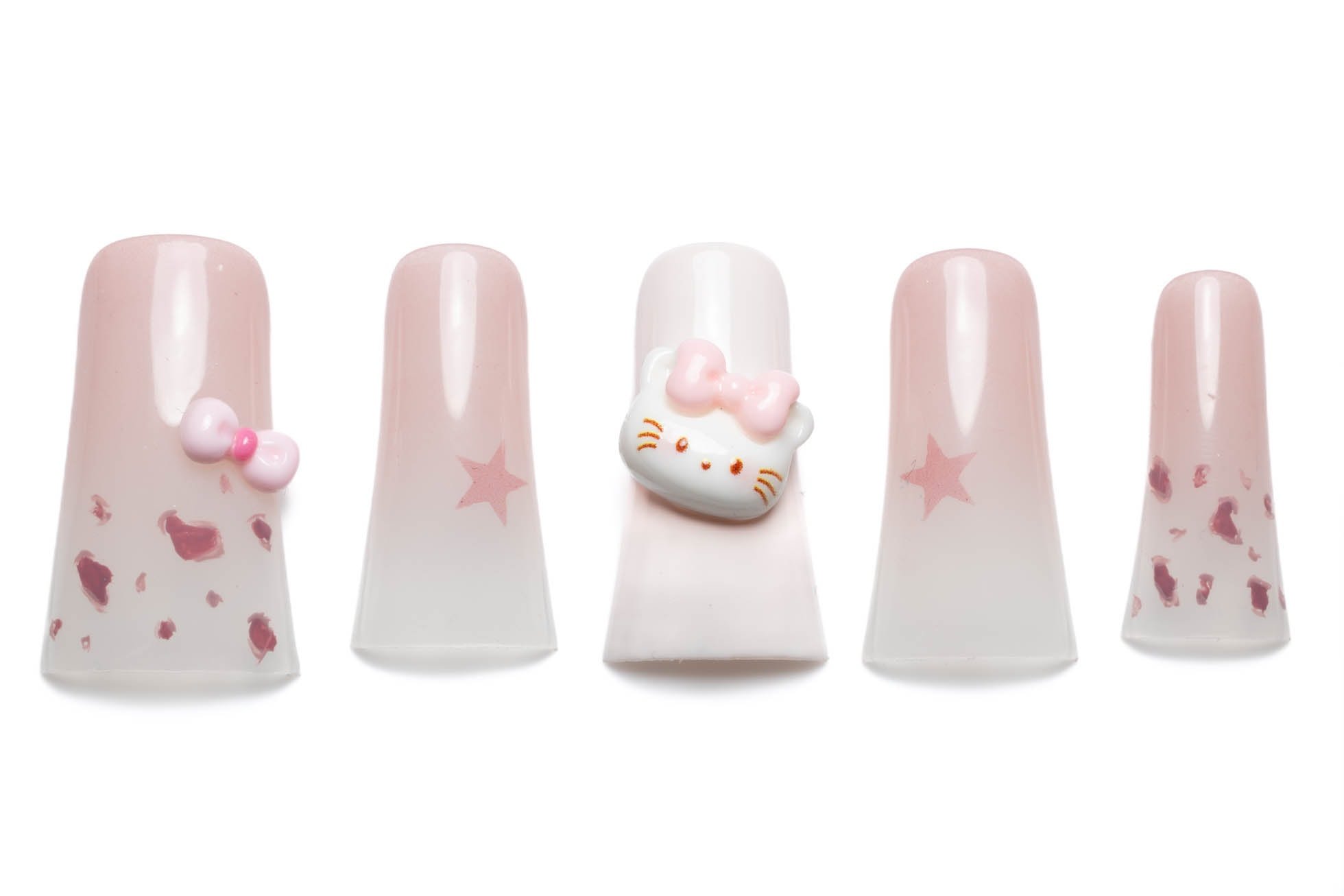 Pink ombre press-on nails decorated with Hello Kitty faces, bows, and star accents in short square style