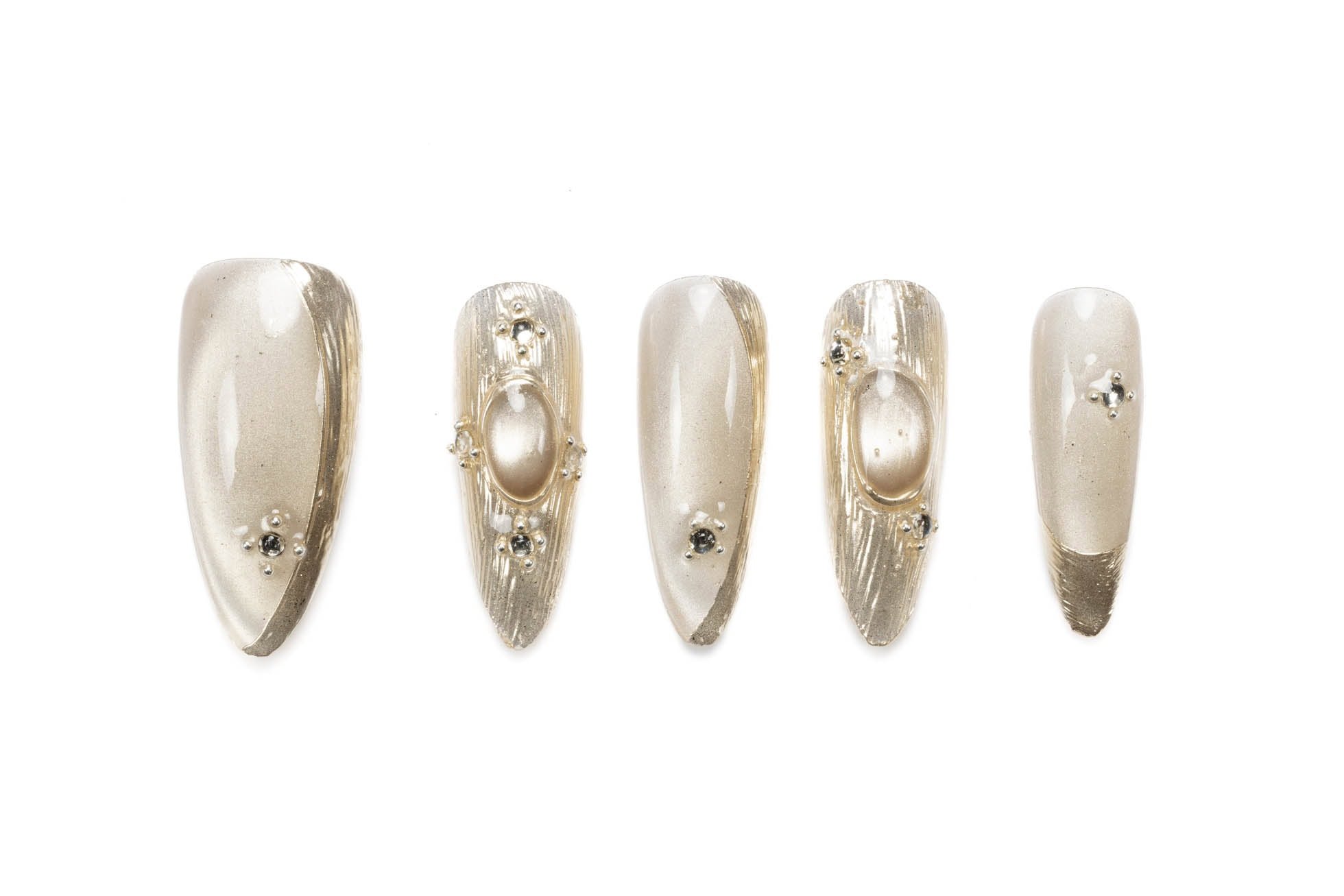 Medium almond-shaped press-on nails with luxurious pearl and gold design, accented with rhinestones.