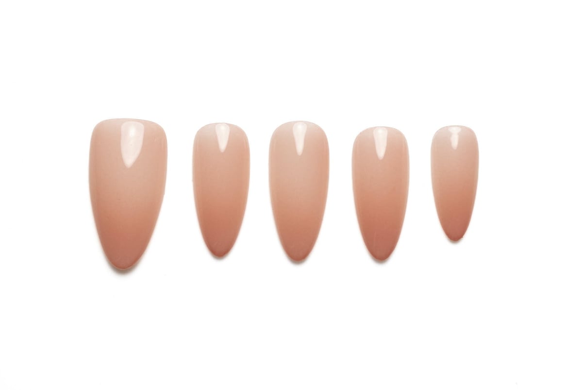 Translucent peachy pink almond press-on nails with natural jelly finish