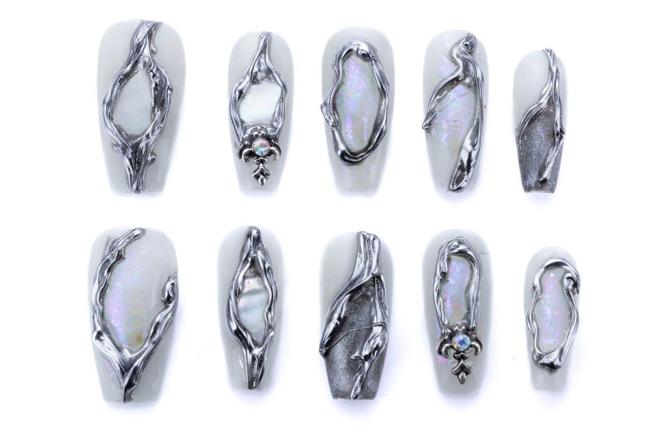 White coffin press-on nails with silver branch patterns and iridescent opal accents, featuring crystal embellishments