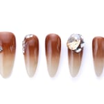 Brown ombre almond-shaped press-on nails with crystal accents and a glossy finish