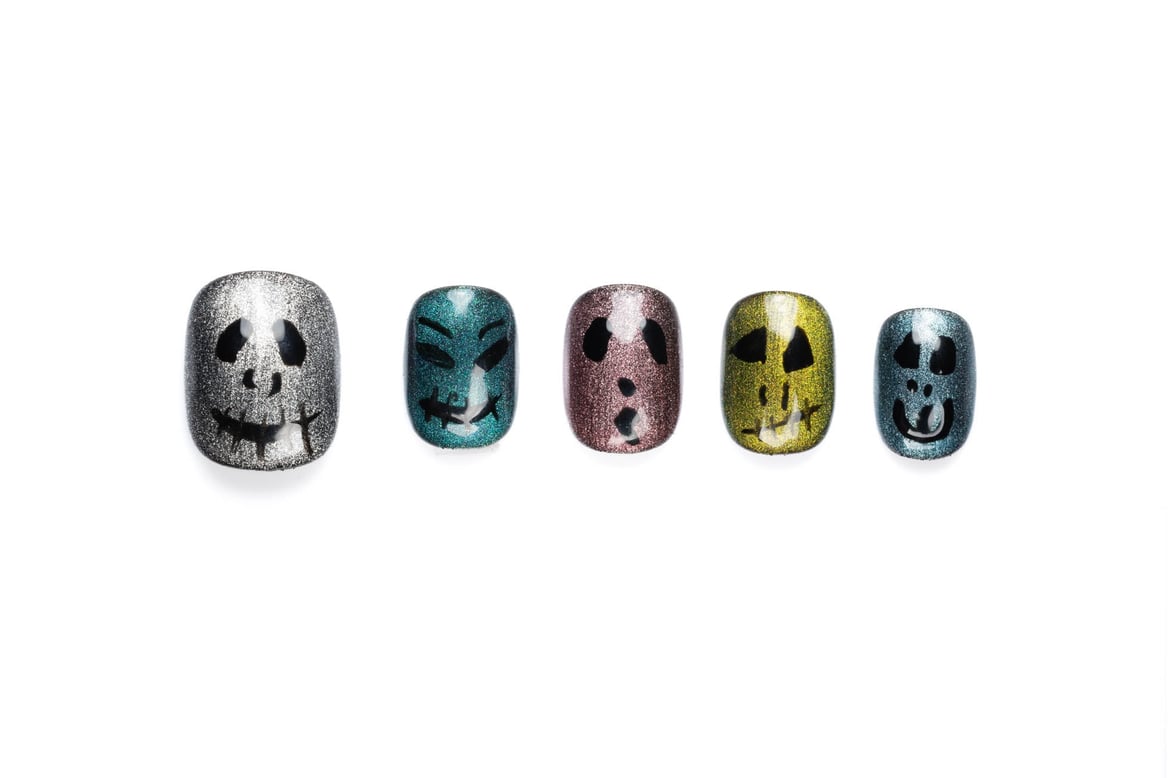 Short round Halloween press-on nails with multicolor cat eye glitter finish and decorative pumpkin face designs