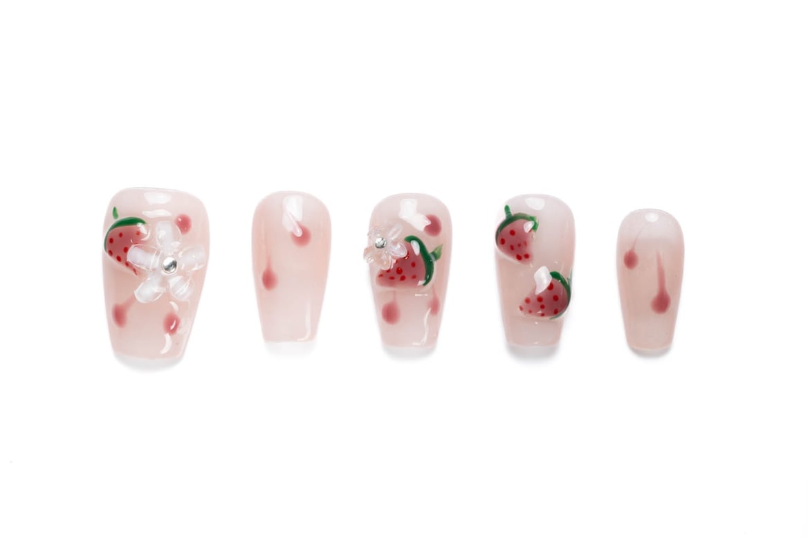 Short coffin press-on nails with pink base and hand-painted strawberries, decorated with 3D flowers and rhinestone accents