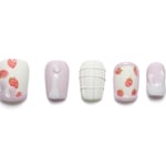 Short squoval press-on nails featuring cute strawberry patterns, pink and white designs, and delicate summer accents