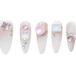 Almond-shaped floral press-on nails with iridescent butterflies and pearl accents on milky white base