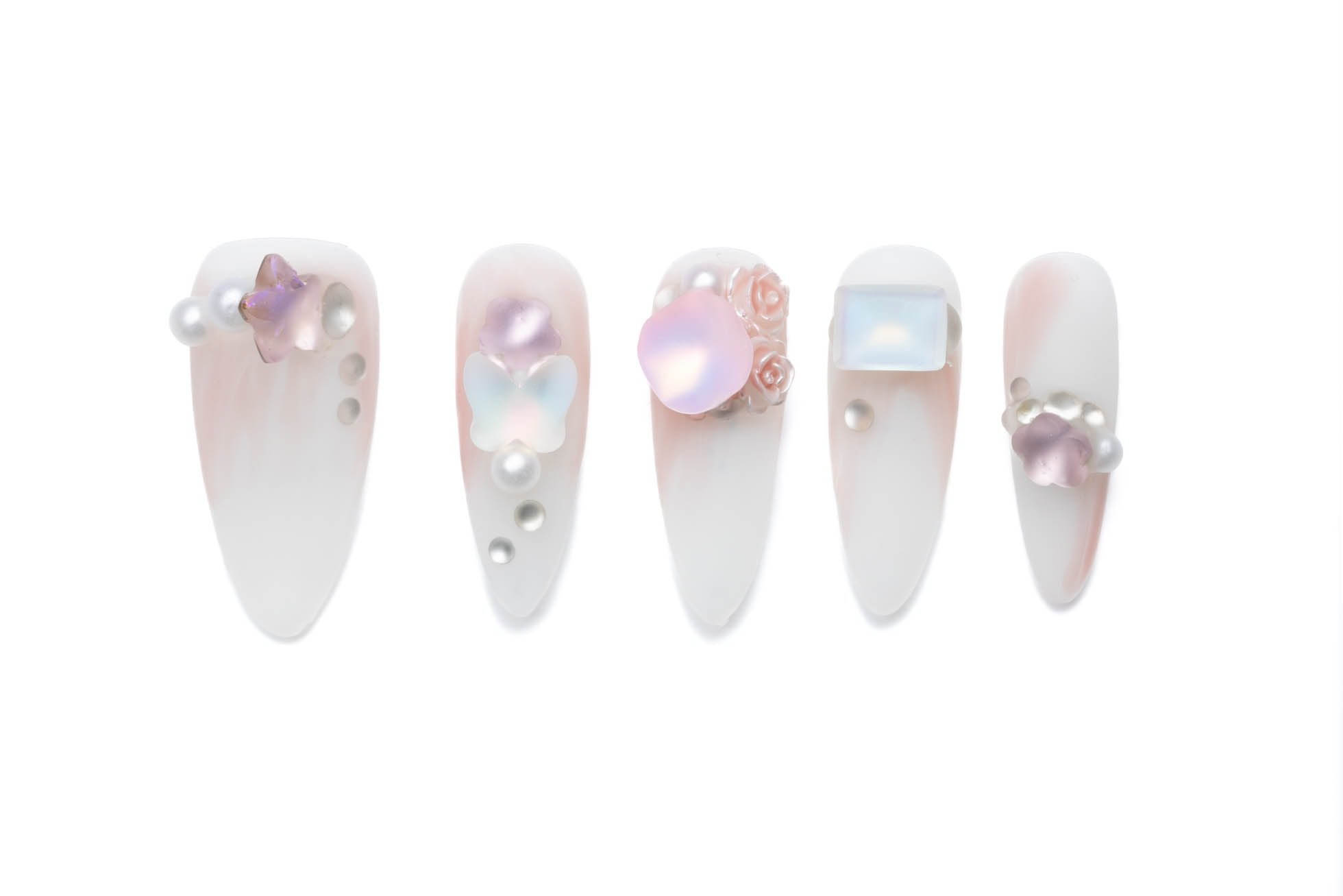 Almond-shaped floral press-on nails with iridescent butterflies and pearl accents on milky white base